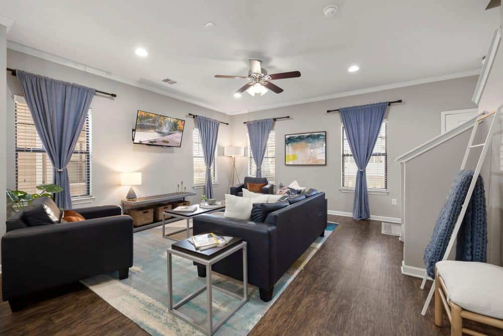the collective at norman apartments near the university of oklahoma fully furnished living room second floor stairs