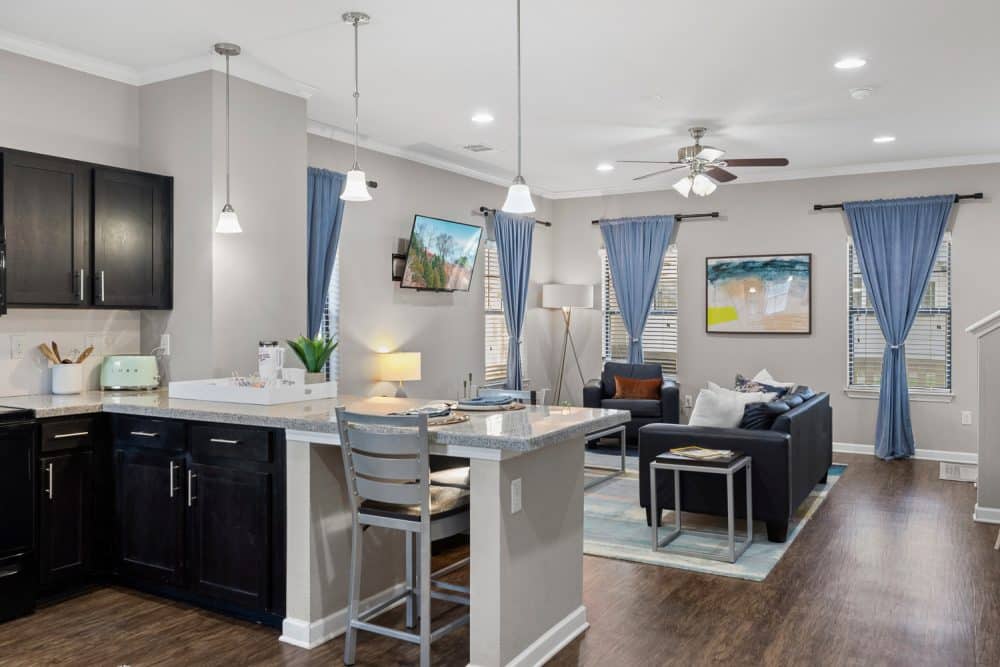 the collective at norman apartments near the university of oklahoma kitchen bar seating and living room