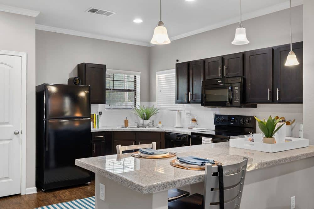 the collective at norman apartments near the university of oklahoma kitchen with island seating