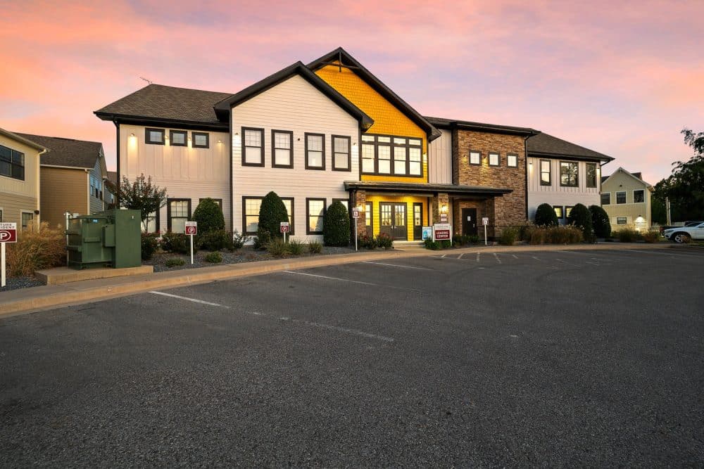 the collective at norman apartments near the university of oklahoma leasing office clubhouse exterior sunset