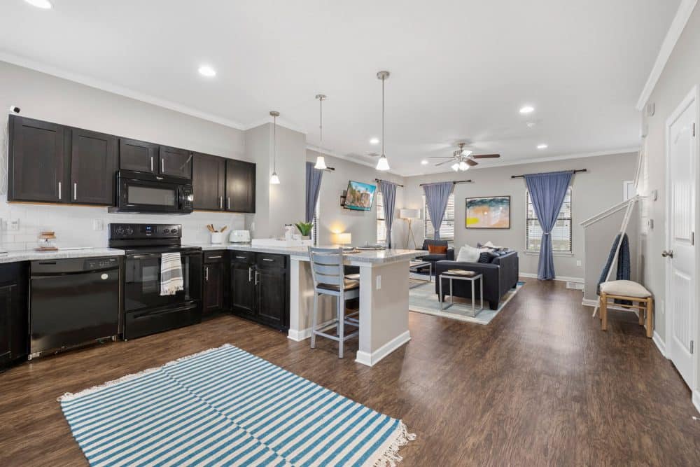 the collective at norman apartments near the university of oklahoma open concept floor plan kitchen and living room