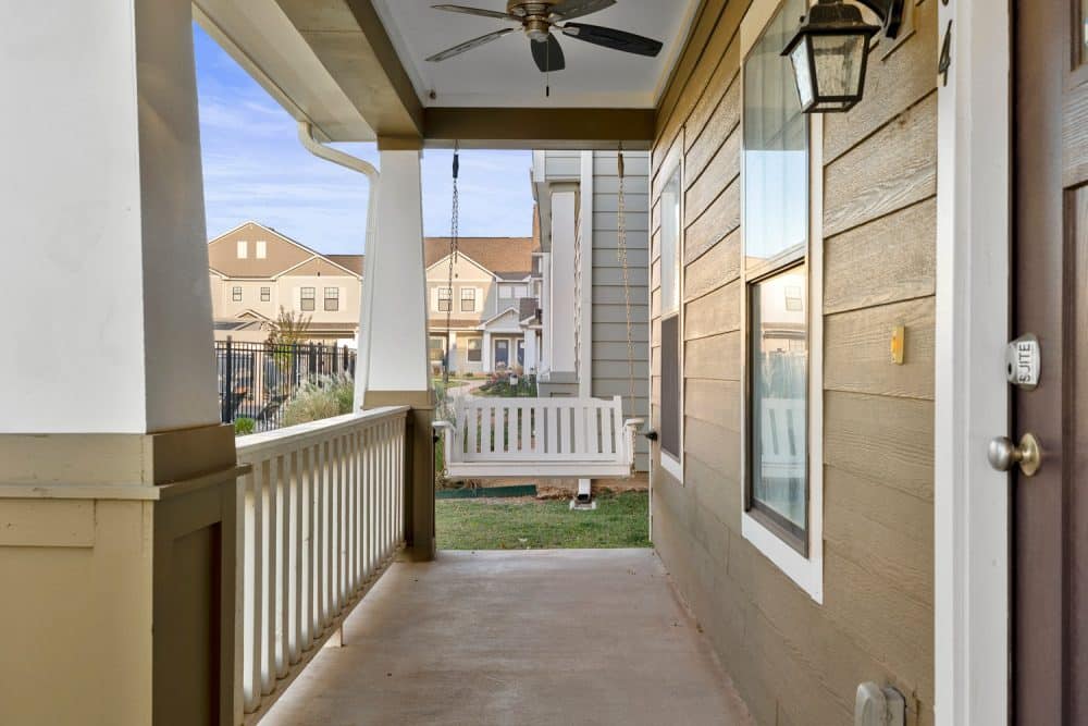 the collective at norman apartments near the university of oklahoma private patio porch swing