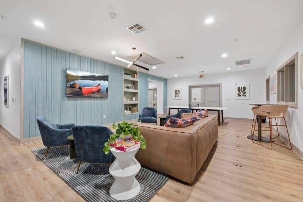 the collective at norman apartments near the university of oklahoma resident clubhouse game room lounge seating