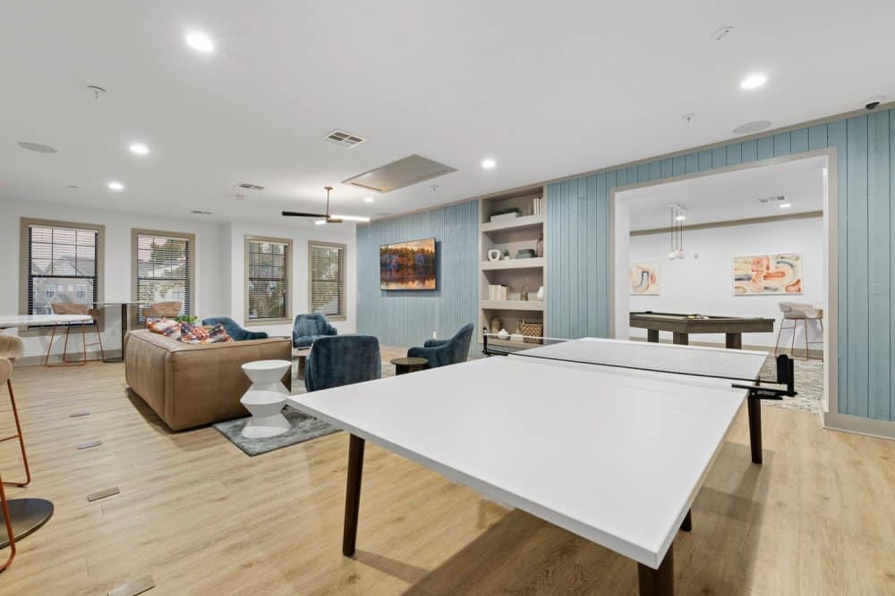 the collective at norman apartments near the university of oklahoma resident clubhouse game room ping pong table