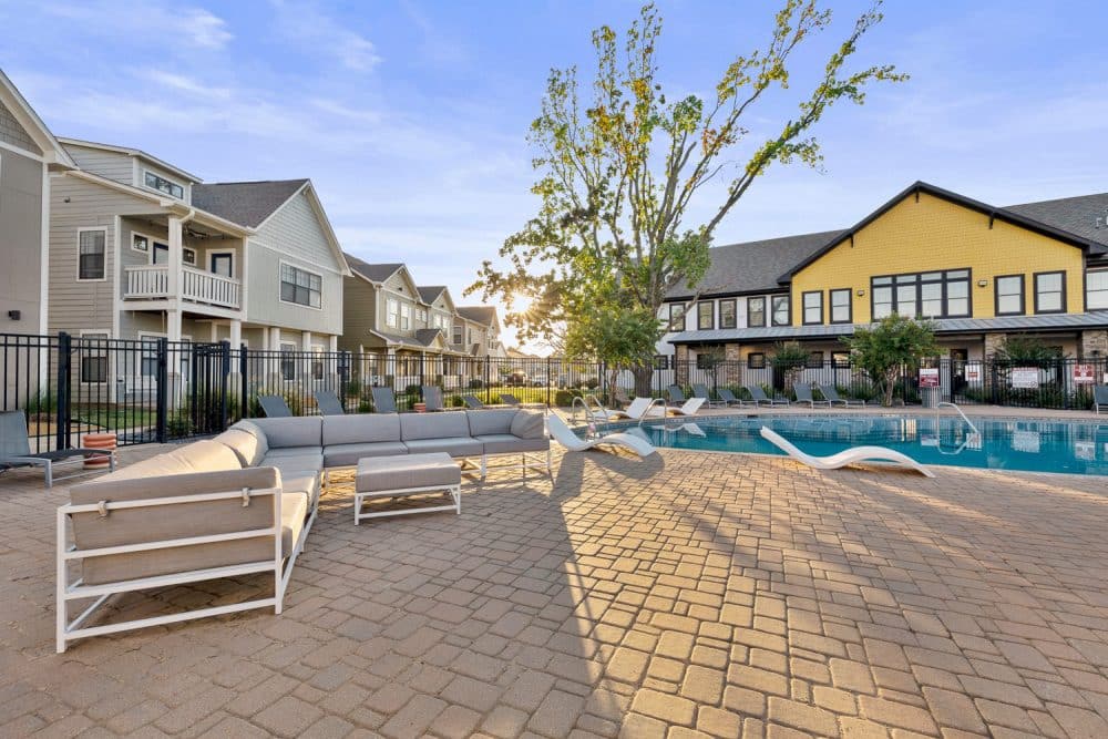 the collective at norman apartments near the university of oklahoma resort style pool poolside lounge seating